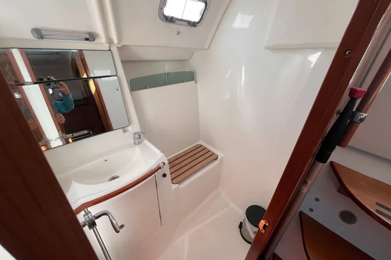 Slide: The Image of Bathroom interior of 2008 Beneteau Oceanis 343 yacht, featuring sink and mirror. - 20