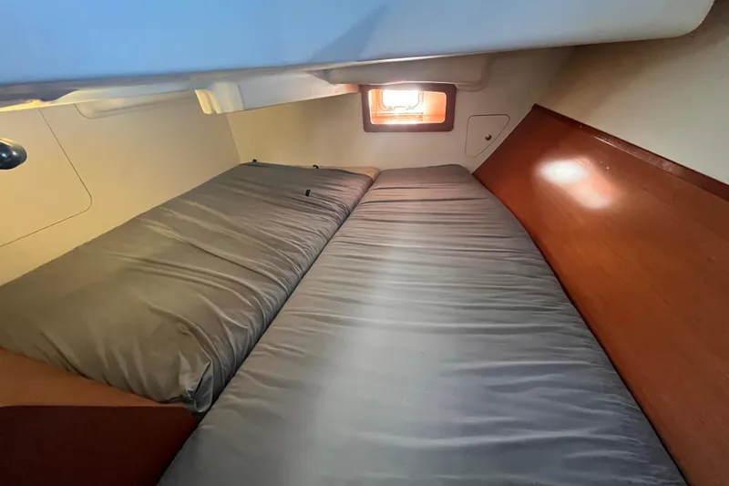 Slide: The Image of Cozy cabin interior of 2008 Beneteau Oceanis 343 sailboat with comfortable bedding. - 22