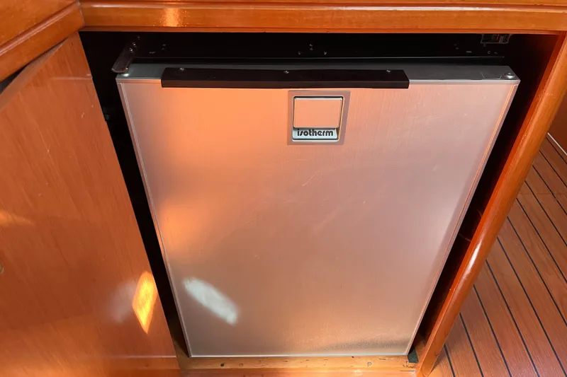 Slide: The Image of Isotherm fridge in 2008 Beneteau Oceanis 343 yacht interior, wooden cabinetry. - 25