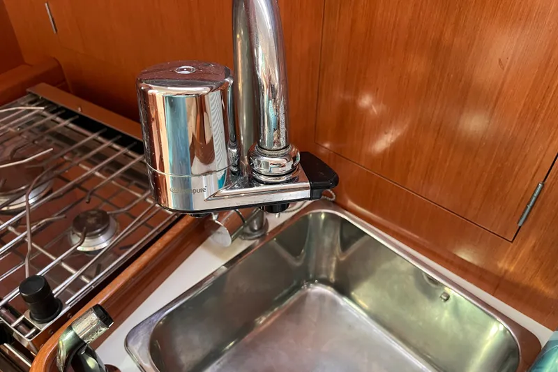Slide: The Image of Galley sink and faucet in 2008 Beneteau Oceanis 343 sailboat kitchen. - 27