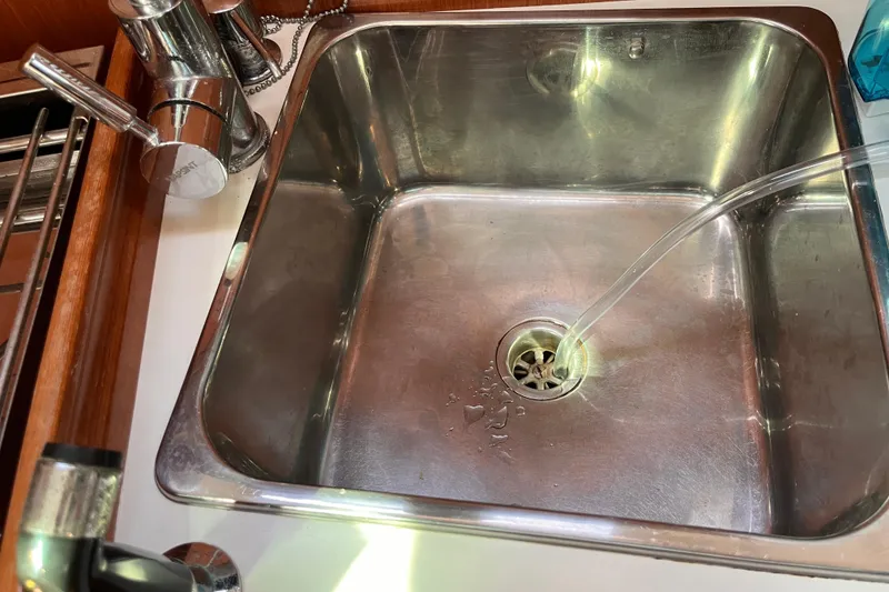 Slide: The Image of Stainless steel sink on 2008 Beneteau Oceanis 343 yacht, with water flowing from a tube. - 28