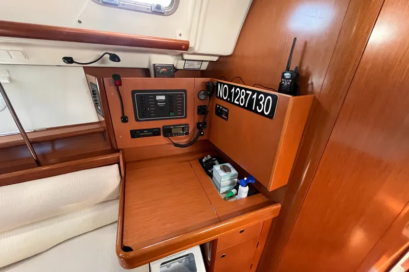 Slide: The Image of Interior of 2008 Beneteau Oceanis 343 sailboat with navigation equipment and wooden finish. - 32
