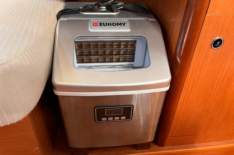 Slide: The Image of Portable Euhomy ice maker on Beneteau Oceanis 343 yacht, 2008 model, in wooden interior setting. - 33