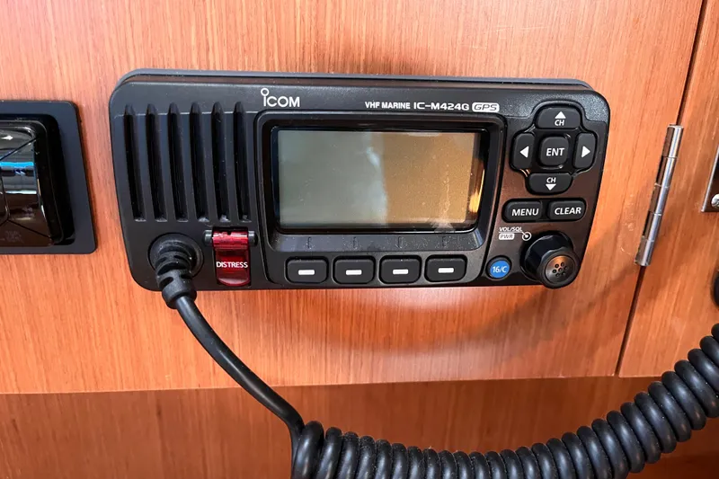 Slide: The Image of Icom VHF marine radio on 2008 Beneteau Oceanis 343 yacht, featuring distress button. - 34