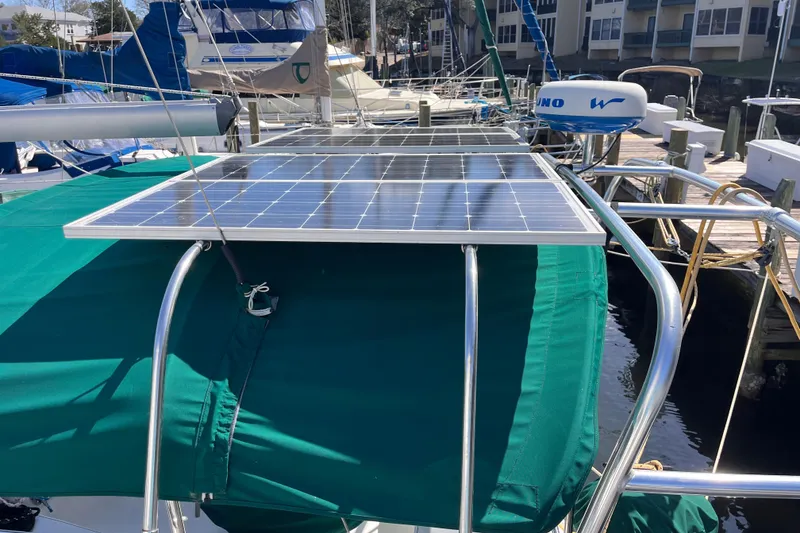 Slide: The Image of Beneteau Oceanis 343 sailboat with solar panel, docked, green canopy, 2008 model. - 4