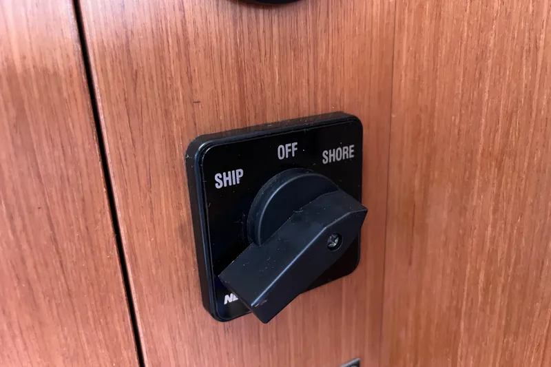 Slide: The Image of Switch panel on 2008 Beneteau Oceanis 343 yacht, labeled "Ship," "Off," "Shore." - 41