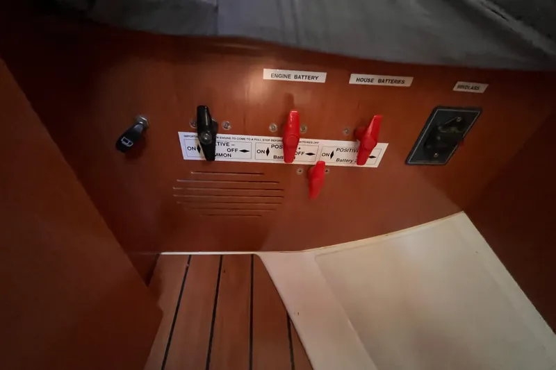 Slide: The Image of Control panel of a 2008 Beneteau Oceanis 343 sailboat, featuring battery switches. - 53