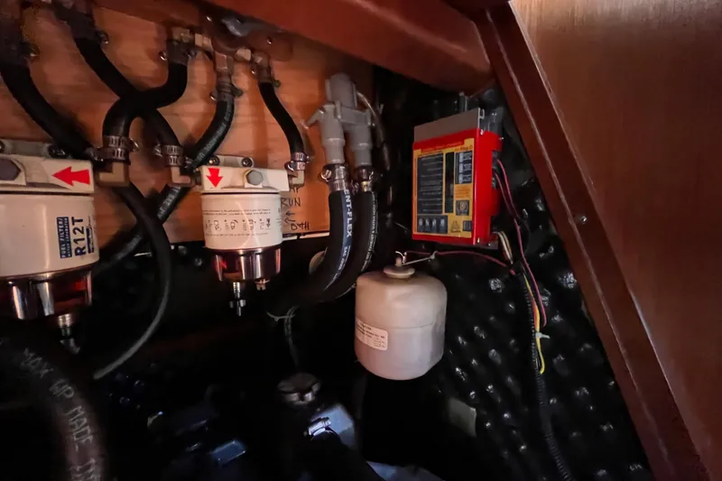 Slide: The Image of Engine compartment of 2008 Beneteau Oceanis 343 with fuel filters and wiring. - 55