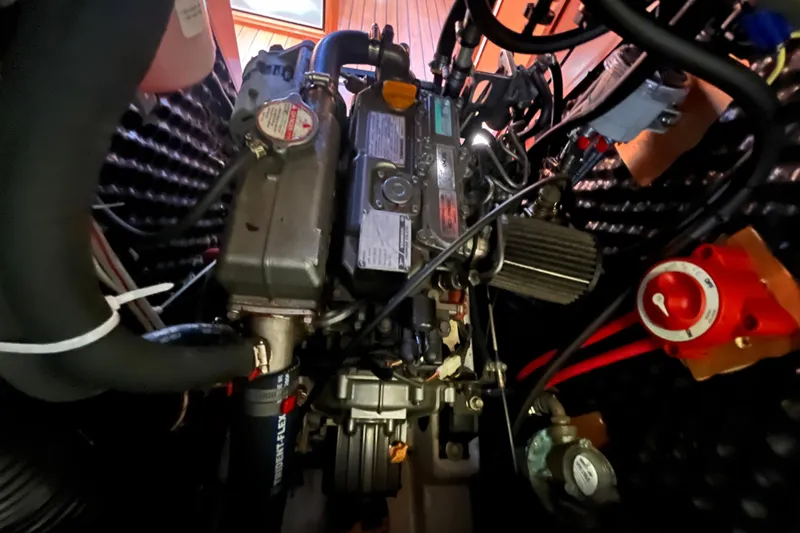 Slide: The Image of Engine compartment of a 2008 Beneteau Oceanis 343 sailboat, showcasing mechanical components. - 56