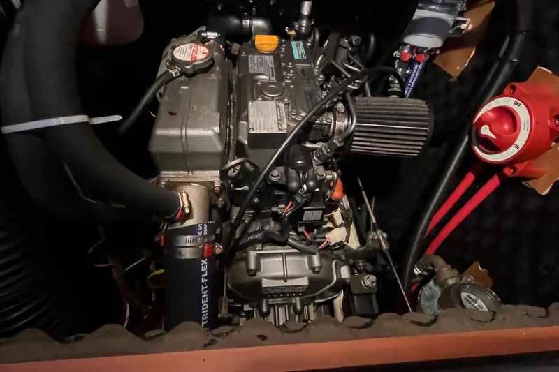 Slide: The Image of Engine compartment of a 2008 Beneteau Oceanis 343 sailboat, showcasing mechanical components. - 60