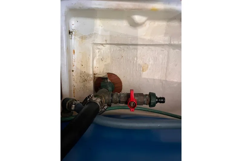 Slide: The Image of Plumbing system inside 2008 Beneteau Oceanis 343 sailboat, featuring pipes and valve. - 63