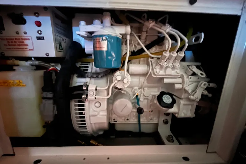 Slide: The Image of Engine compartment of a 2008 Beneteau Oceanis 343 sailboat, showcasing mechanical components. - 67