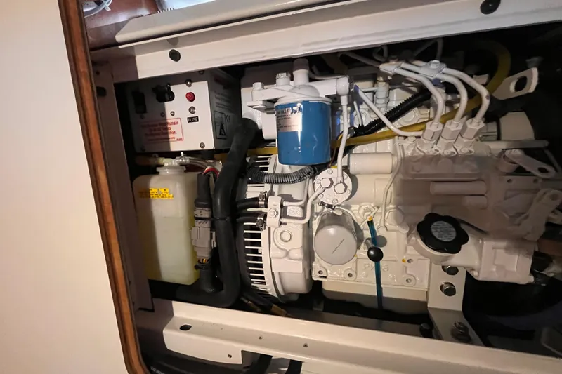 Slide: The Image of Engine compartment of a 2008 Beneteau Oceanis 343 sailboat, showcasing mechanical components. - 68