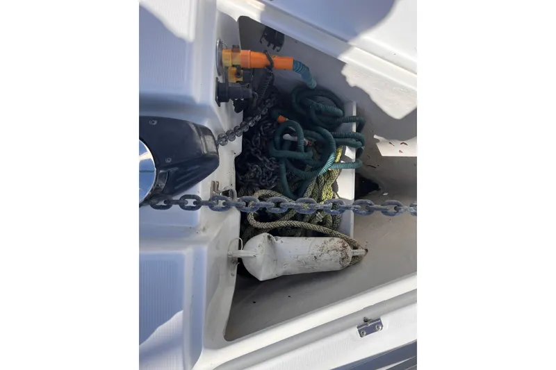 Slide: The Image of Anchor locker of 2008 Beneteau Oceanis 343 with chain, ropes, and fender. - 72