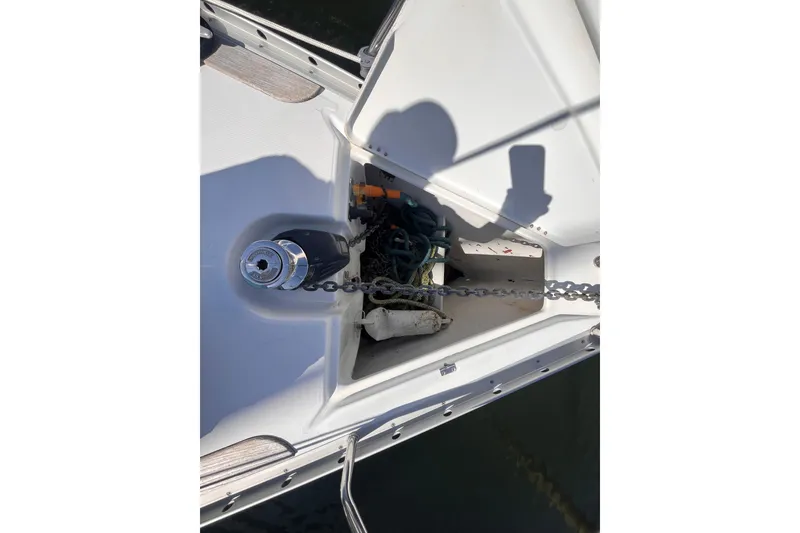 Slide: The Image of Anchor locker of 2008 Beneteau Oceanis 343 sailboat with chain and winch. - 73