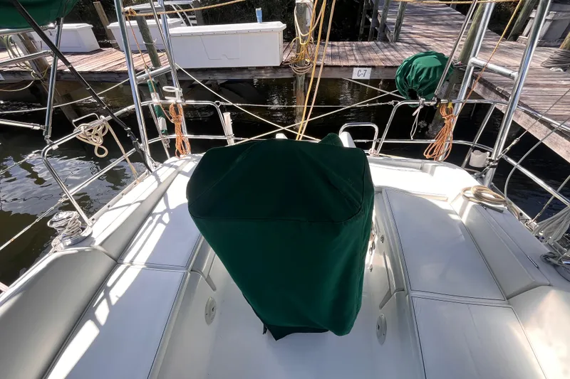 Slide: The Image of Beneteau Oceanis 343 sailboat cockpit, 2008 model, docked with green cover and ropes. - 8