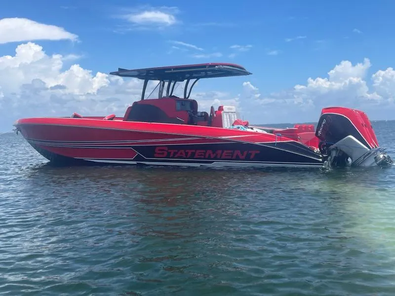 Slide: The Image of Red 2024 Statement 350 Open boat on water under blue sky. - 18