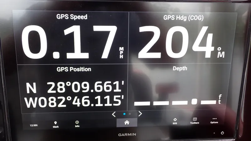 Slide: The Image of Garmin GPS display showing speed, heading, and position on a 2024 Statement 350 Open. - 23