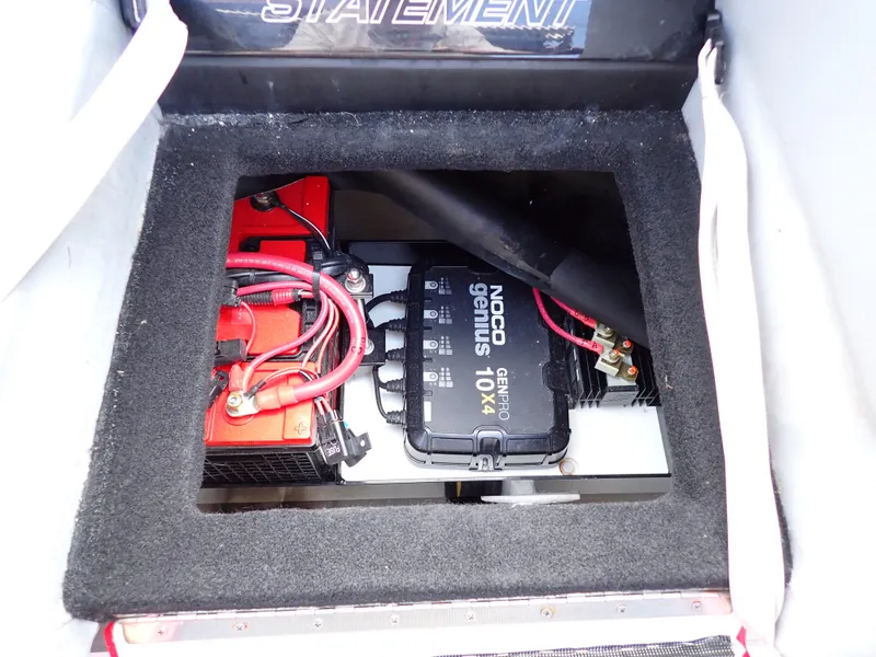 Slide: The Image of 2024 Statement 350 Open battery compartment with NOCO Genius charger. - 32