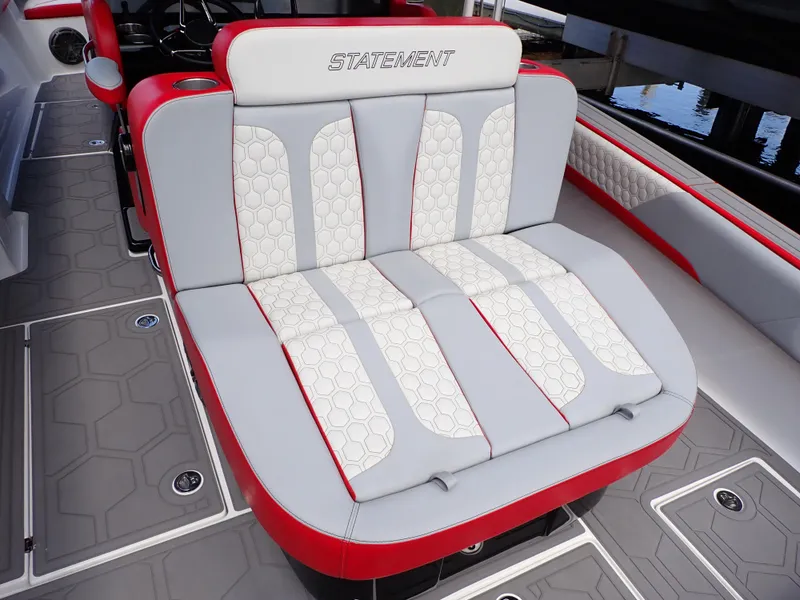 Slide: The Image of 2024 Statement 350 Open boat seating with red and white upholstery, featuring hexagonal patterns. - 33