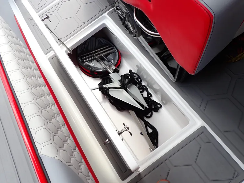 Slide: The Image of 2024 Statement 350 Open boat storage compartment with anchor and rope. - 44