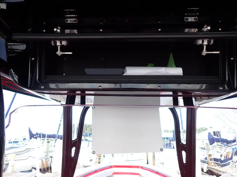 Slide: The Image of 2024 Statement 350 Open boat interior with storage compartment and marina view. - 48