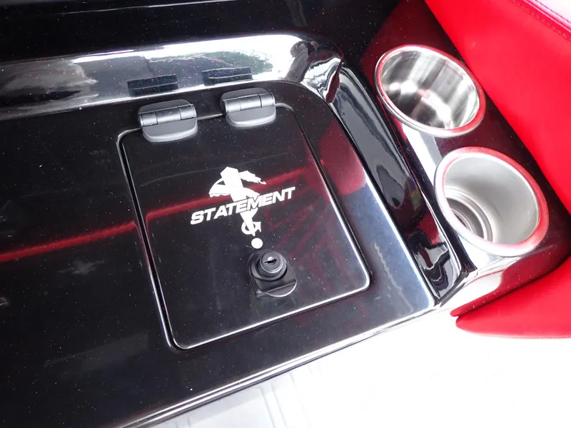 Slide: The Image of 2024 Statement 350 Open boat console with cup holders and storage compartment. - 49