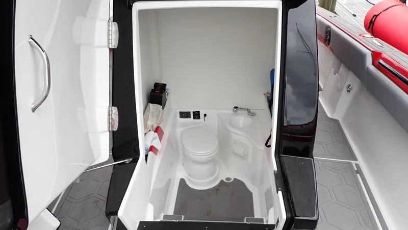 Slide: The Image of 2024 Statement 350 Open boat interior with compact bathroom amenities. - 6