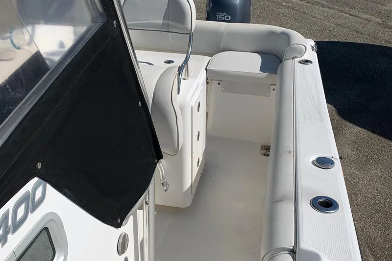 Slide: The Image of 2008 Century 2400 Center Console boat interior with seating and Yamaha 150 engine. - 11