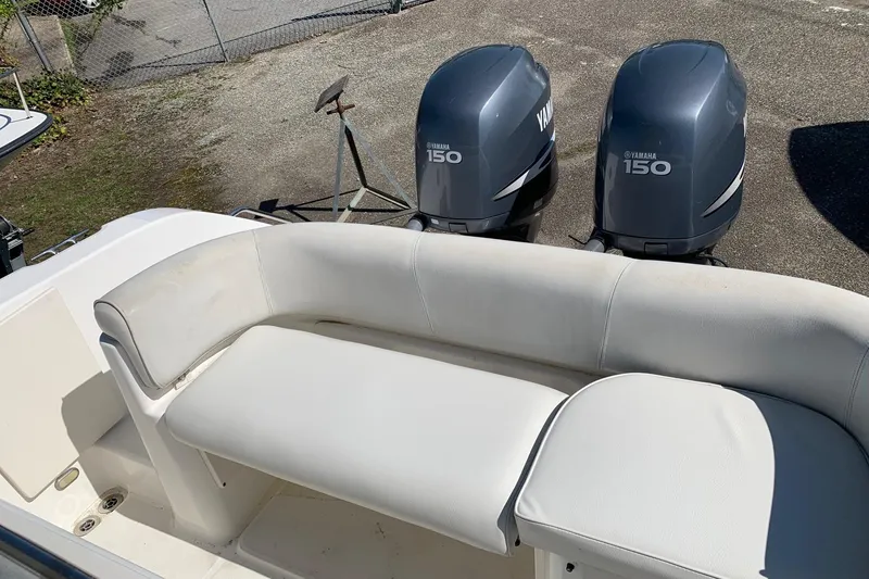 Slide: The Image of 2008 Century 2400 Center Console boat with Yamaha 150 engines and white seating. - 13