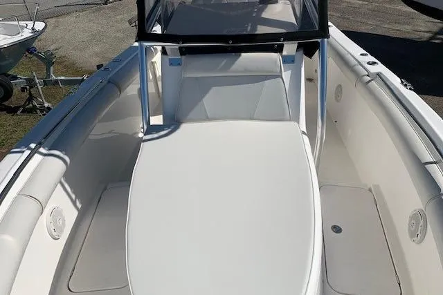 Slide: The Image of 2008 Century 2400 Center Console boat interior with cushioned seating and console. - 2
