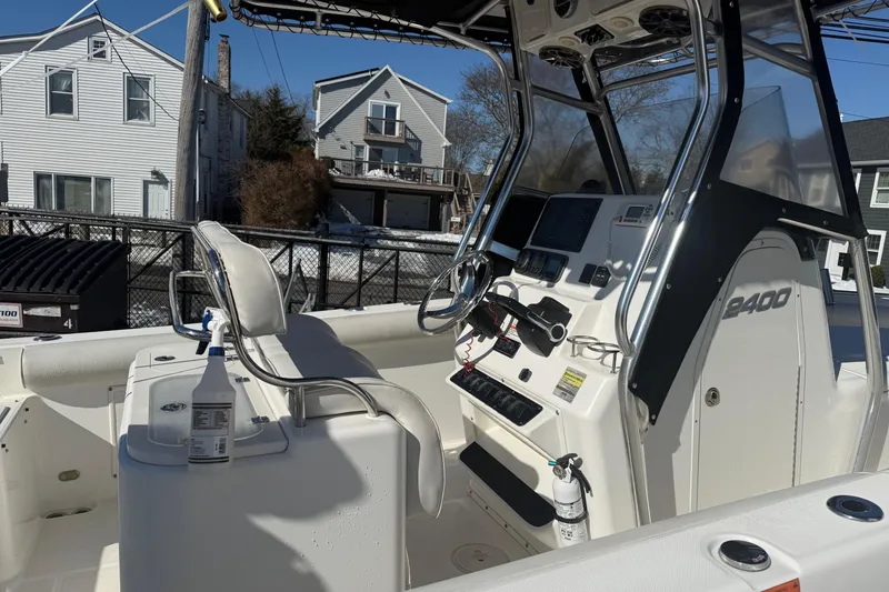 Slide: The Image of 2008 Century 2400 Center Console boat interior with steering and control panel. - 27