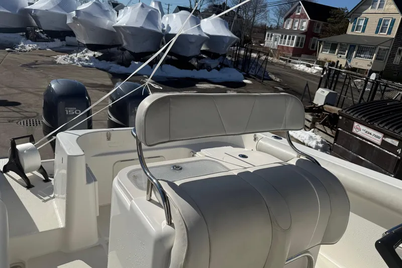 Slide: The Image of 2008 Century 2400 Center Console boat with dual Yamaha 150 engines, docked in snowy marina. - 28
