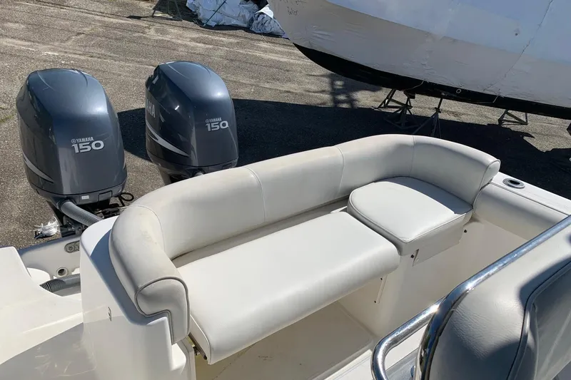 Slide: The Image of 2008 Century 2400 Center Console boat with Yamaha 150 engines and cushioned seating. - 3