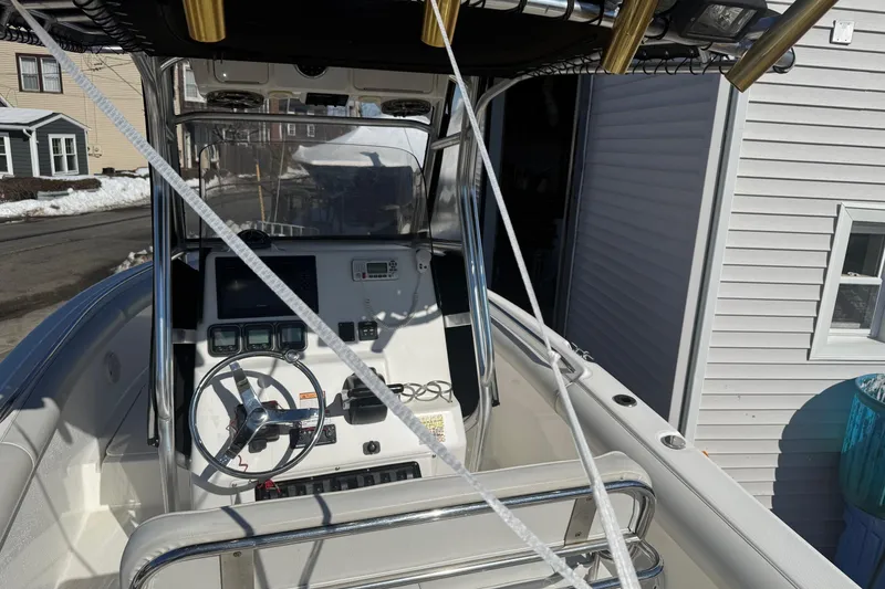 Slide: The Image of 2008 Century 2400 Center Console boat interior with steering wheel and control panel. - 31