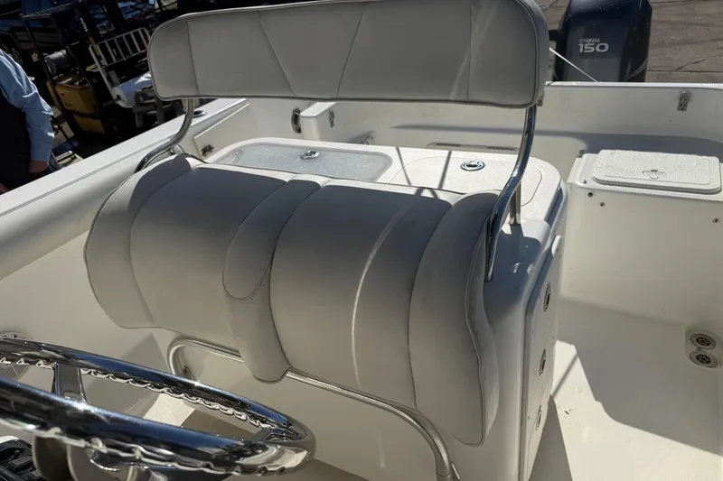 Slide: The Image of 2008 Century 2400 Center Console boat interior with steering wheel and seating. - 32