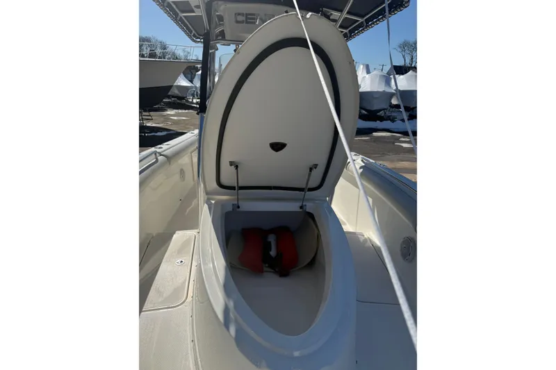 Slide: The Image of 2008 Century 2400 Center Console boat with open storage compartment. - 33