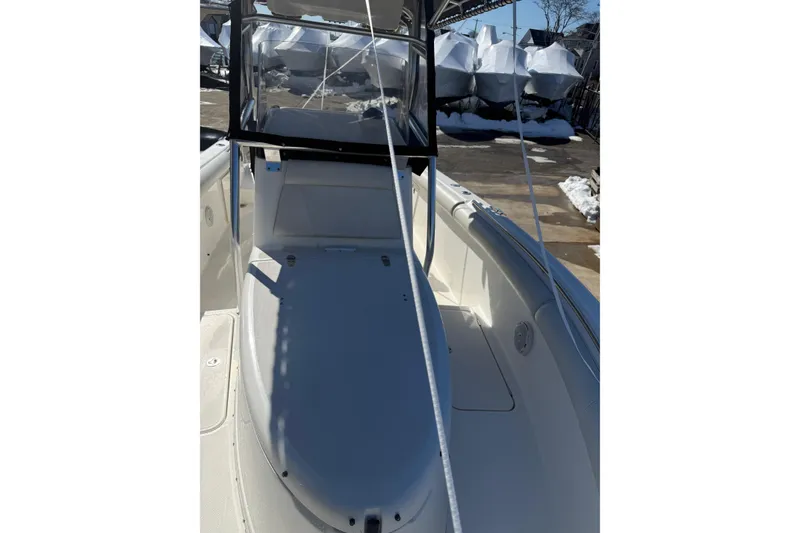 Slide: The Image of 2008 Century 2400 Center Console boat with clean deck and protective cover. - 34