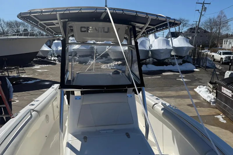 Slide: The Image of 2008 Century 2400 Center Console boat in a snowy marina setting. - 35