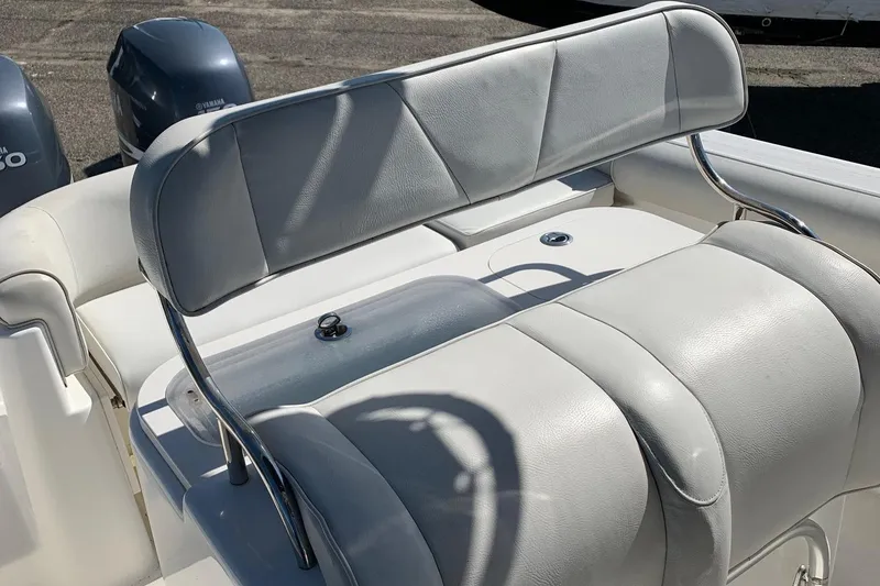 Slide: The Image of 2008 Century 2400 Center Console boat with dual Yamaha engines and cushioned seating. - 4