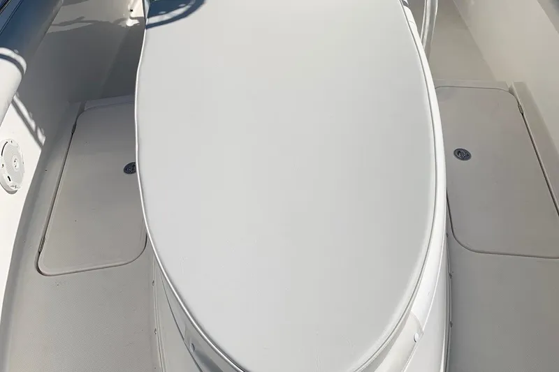 Slide: The Image of 2008 Century 2400 Center Console boat interior, featuring sleek white seating and deck design. - 5