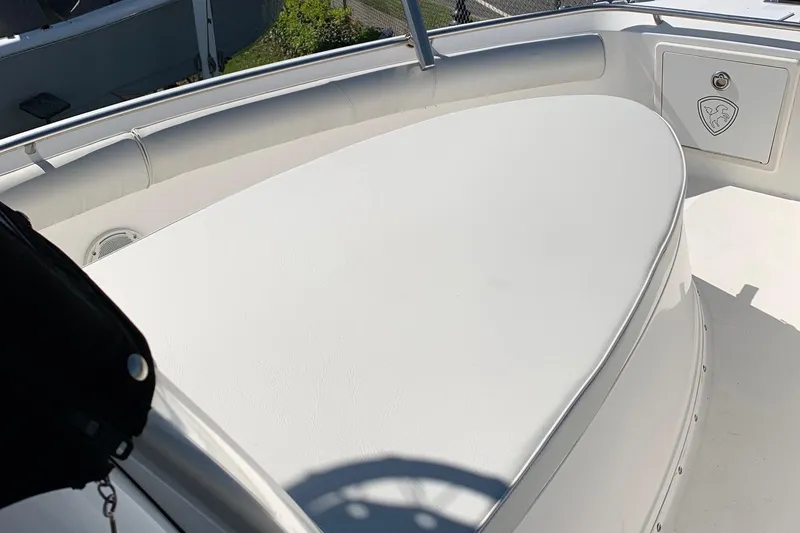 Slide: The Image of 2008 Century 2400 Center Console boat with white cushioned seating area. - 6