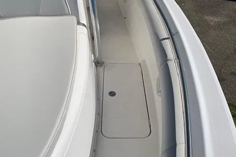Slide: The Image of 2008 Century 2400 Center Console boat deck with seating and storage compartment. - 8