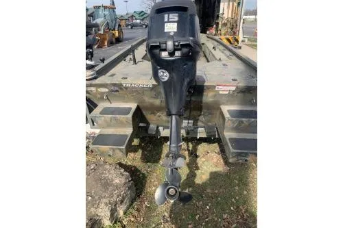 Slide: The Image of 2017 Tracker Grizzly 1548 MVX Sportsman boat with outboard motor, rear view. - 7