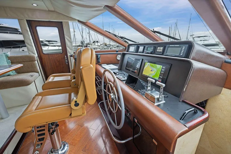 Slide: The Image of Cockpit of 1998 Pacific Mariner 65 yacht with navigation equipment and leather seating. - 22
