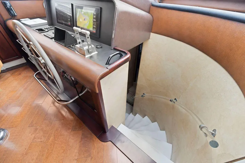 Slide: The Image of Cockpit of 1998 Pacific Mariner 65 yacht with navigation equipment and staircase. - 28