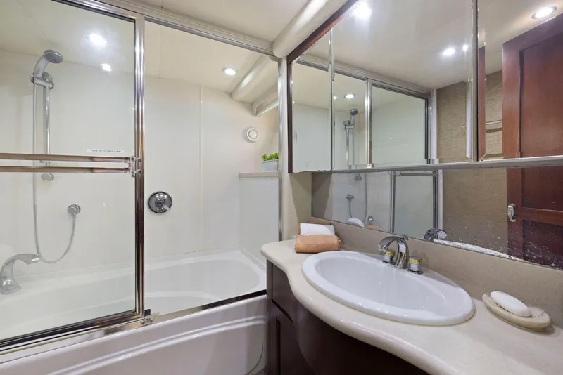 Slide: The Image of Luxurious bathroom in 1998 Pacific Mariner 65 yacht with shower and vanity. - 35