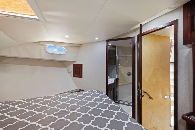 Slide: The Image of Luxurious bedroom and bathroom interior of a 1998 Pacific Mariner 65 yacht. - 40
