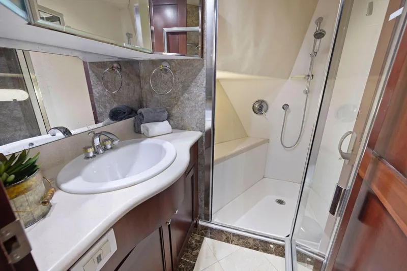Slide: The Image of Luxurious bathroom in 1998 Pacific Mariner 65 yacht with shower and sink. - 42