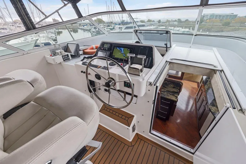 Slide: The Image of Cockpit of 1998 Pacific Mariner 65 yacht with navigation equipment and luxurious interior. - 47